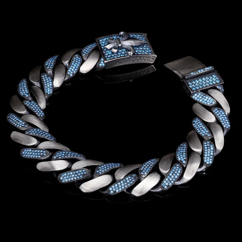 RARE PRINCE by CARAT SUTRA | 16mm Unique Fleur-De-Lis Blue Iced Cuban Link Bracelet for Men | Dark Oxidized 925 Silver Bracelet | Men's Jewelry | With Certificate of Authenticity and 925 Hallmark