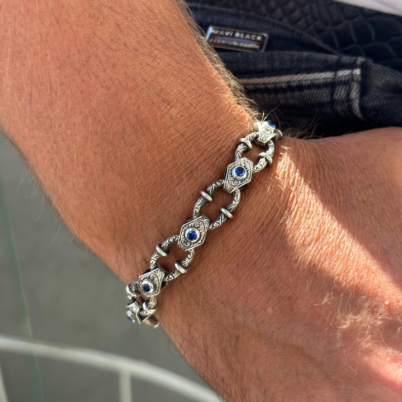 Infinity Style Hand-Engraved Bracelet with mini Natural Blue Sapphire (Neelam) Stone | 925 Sterling Silver Bracelet | With Certificate of Authenticity and 925 Hallmark - caratsutra