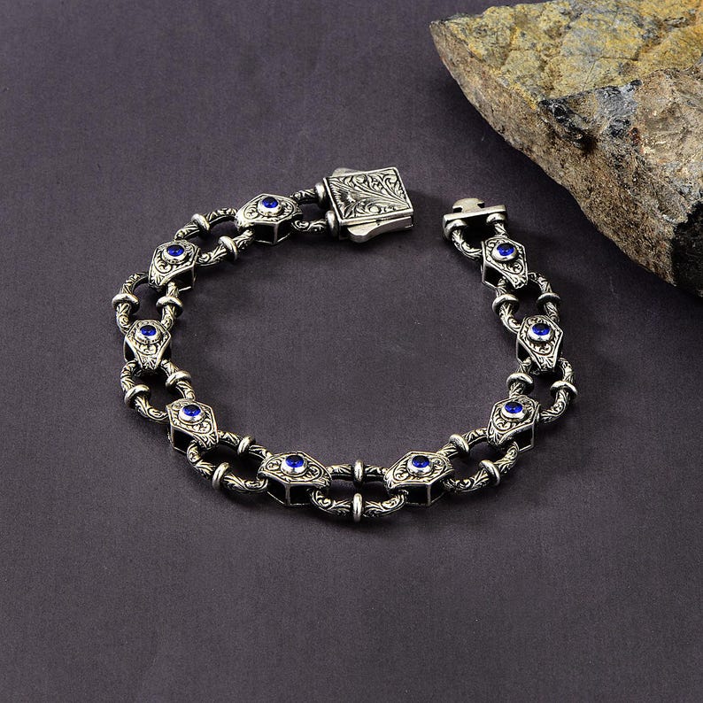 Infinity Style Hand-Engraved Bracelet with mini Natural Blue Sapphire (Neelam) Stone | 925 Sterling Silver Bracelet | With Certificate of Authenticity and 925 Hallmark - caratsutra