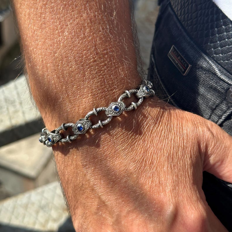Infinity Style Hand-Engraved Bracelet with mini Natural Blue Sapphire (Neelam) Stone | 925 Sterling Silver Bracelet | With Certificate of Authenticity and 925 Hallmark - caratsutra