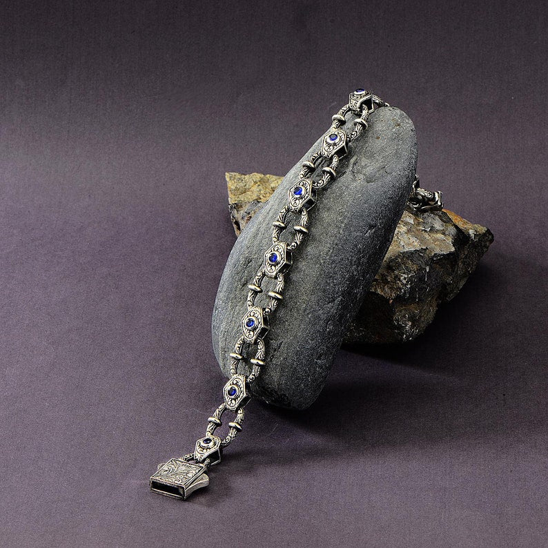 Infinity Style Hand-Engraved Bracelet with mini Natural Blue Sapphire (Neelam) Stone | 925 Sterling Silver Bracelet | With Certificate of Authenticity and 925 Hallmark - caratsutra